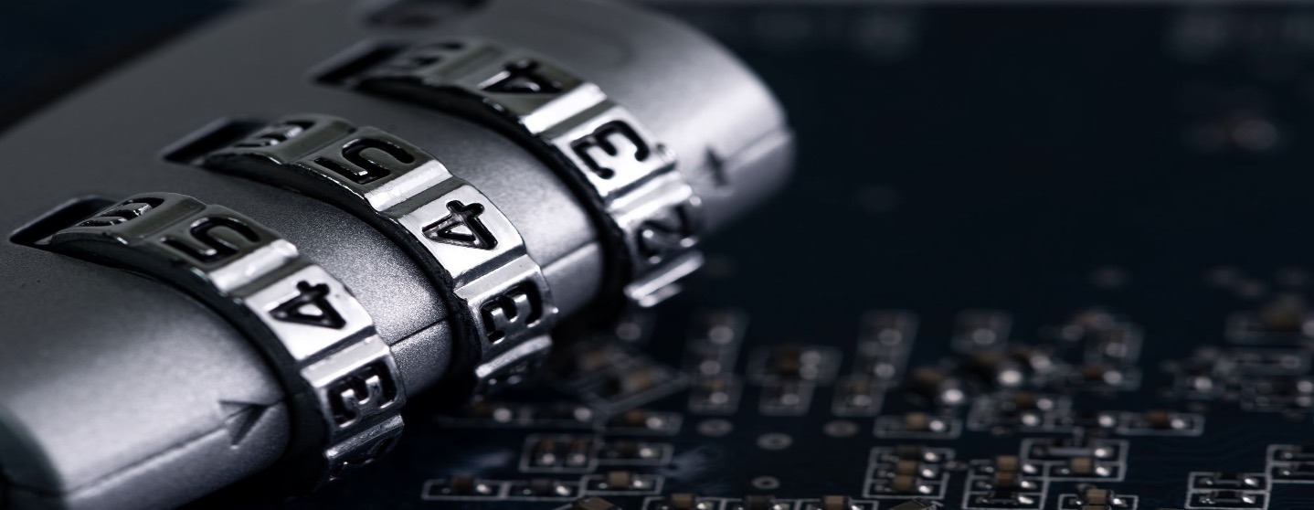 A lock with numbers over a computer digital board.